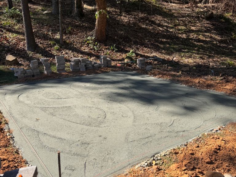 constructing custom paver patio in charlotte nc with base preparation and layout setup for outdoor hardscaping project
