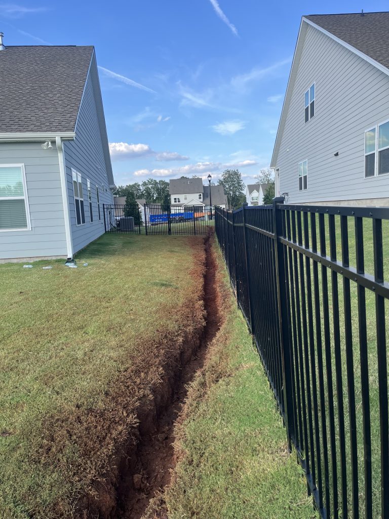 trenching and grading for french drain installation in lancaster sc backyard
