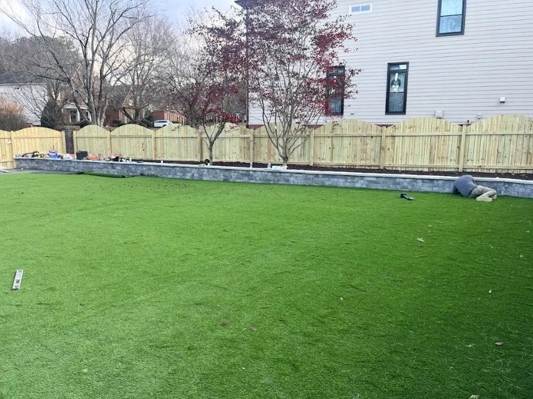 garden wall with a garden bed installed during a artificial turf job by clt pros
