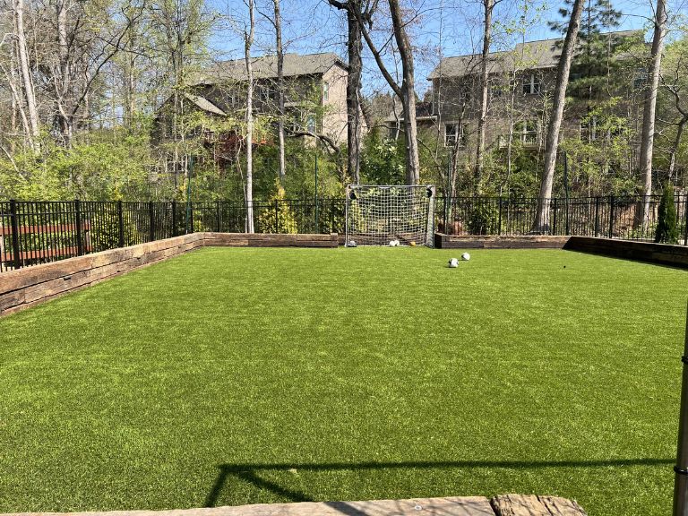 Final walkthrough photo of Carmel Commons Fort Mill SC artificial turf installation — completed CLT Pros project