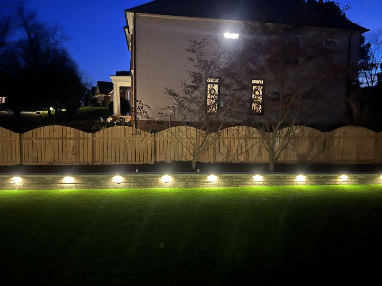 Retaining wall and artificial turf combination at Fort Mill SC Providence Square residential project by CLT Pros