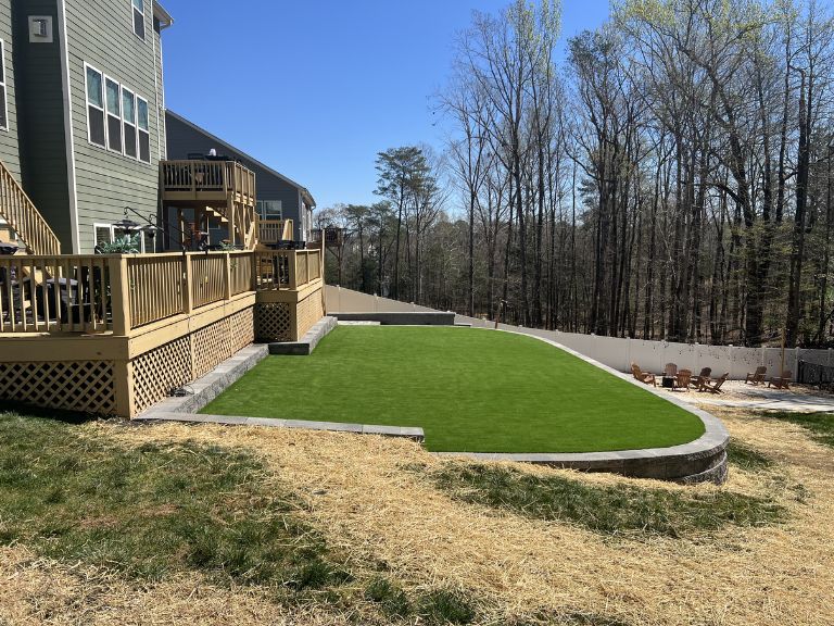 Artificial turf surface detail at Roselyn Lancaster SC — natural-looking blade texture installed by CLT Pros