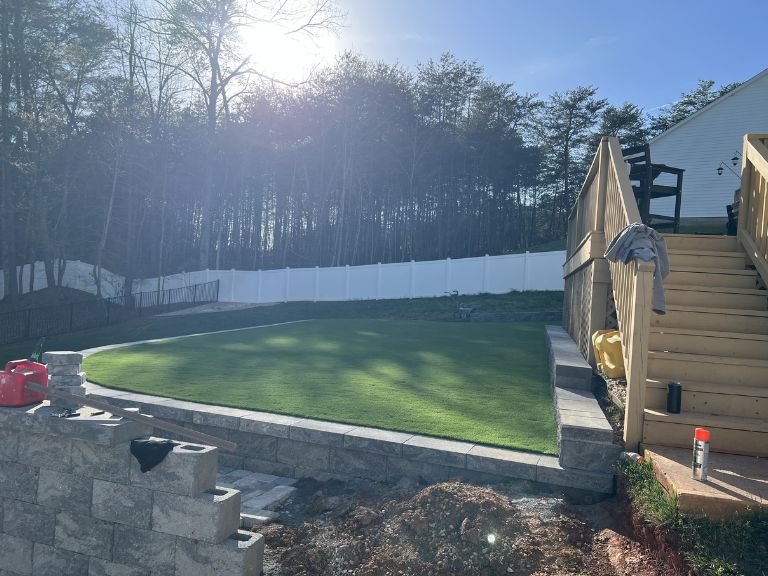 Wide-angle backyard view showing full artificial turf coverage at Roselyn Lancaster SC — CLT Pros project