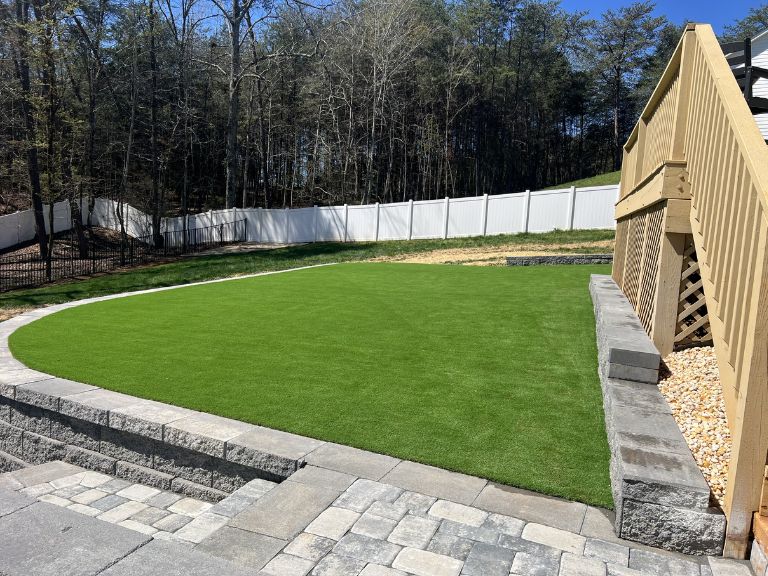 Completed artificial turf installation at Roselyn community Lancaster SC — CLT Pros full backyard green turf transformation