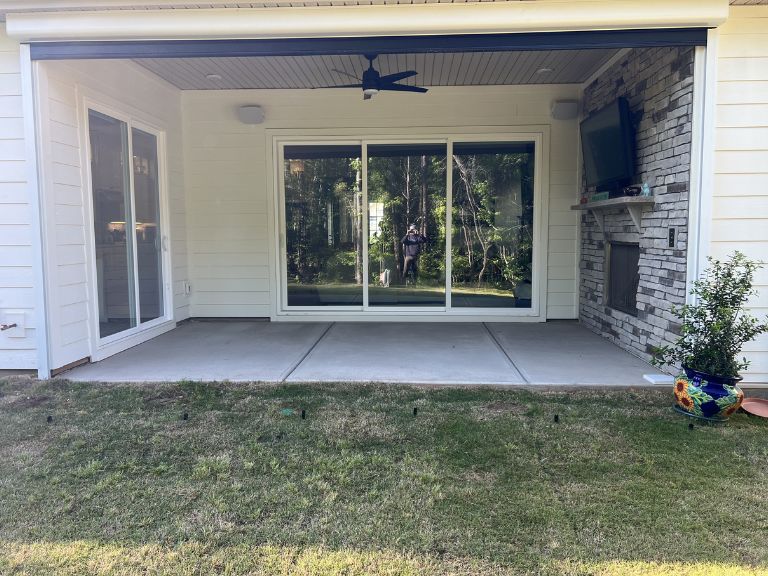 plain concrete covered patio slab ready for marble pavers at an indian land, sc home