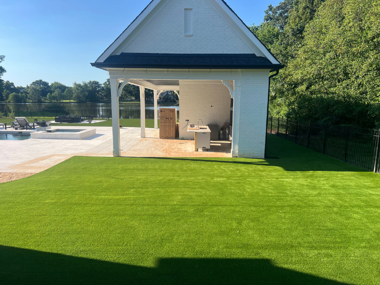 artificial turf beside the pool house porch in weddington, nc