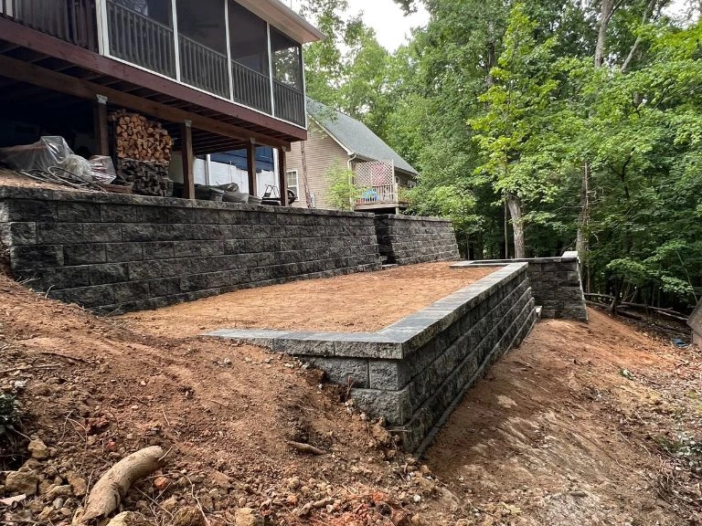 two-tier terraced segmental block retaining wall system with graded flat level between tiers in tega cay sc backyard — clt pros
