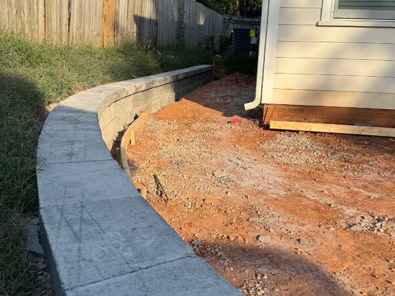 capped retaining wall along the graded patio area next to the house in south end, charlotte, nc