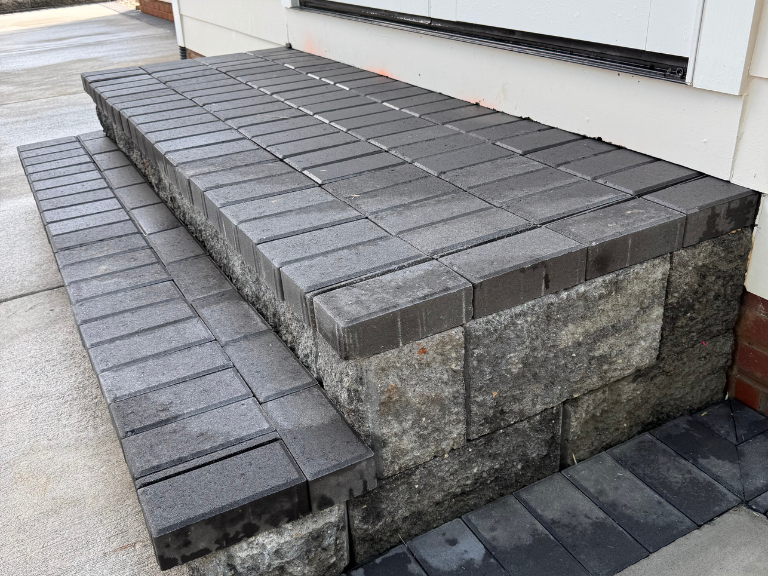 block steps with charcoal paver treads leading to the concrete patio in south end, charlotte, nc