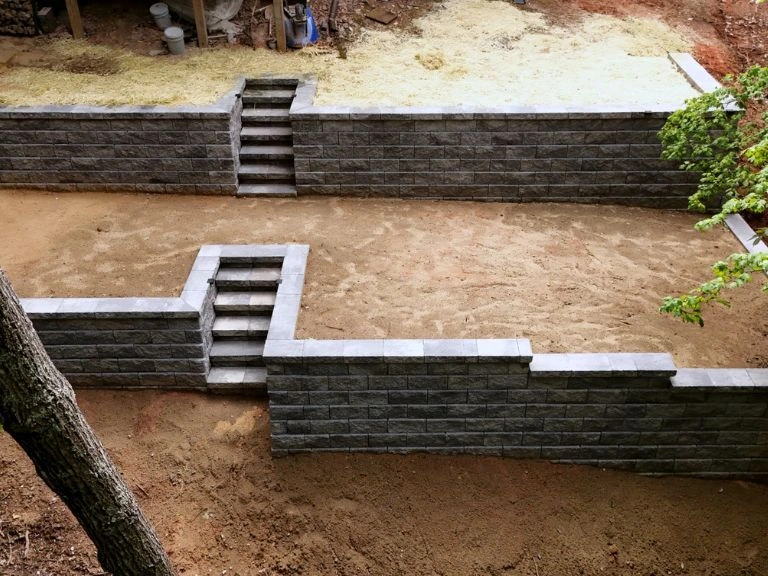 drone overhead view of both terraced retaining wall tiers with integrated steps in tega cay sc — clt pros