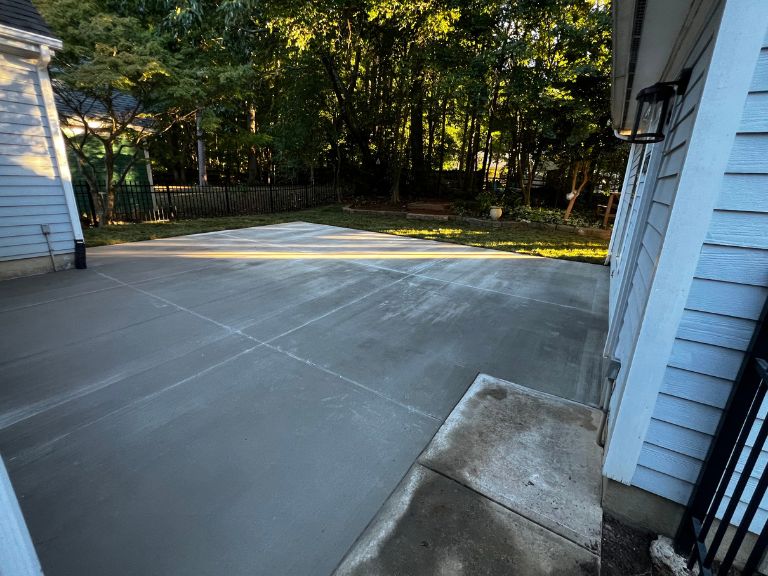 new concrete patio meeting the existing concrete side walkway in huntersville, nc