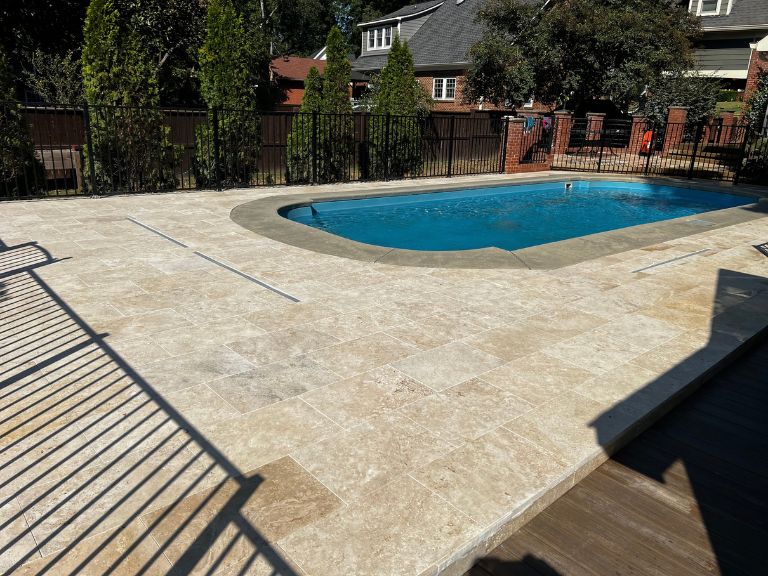 travertine pool deck meeting the trex composite deck walkway in grier heights, charlotte, nc