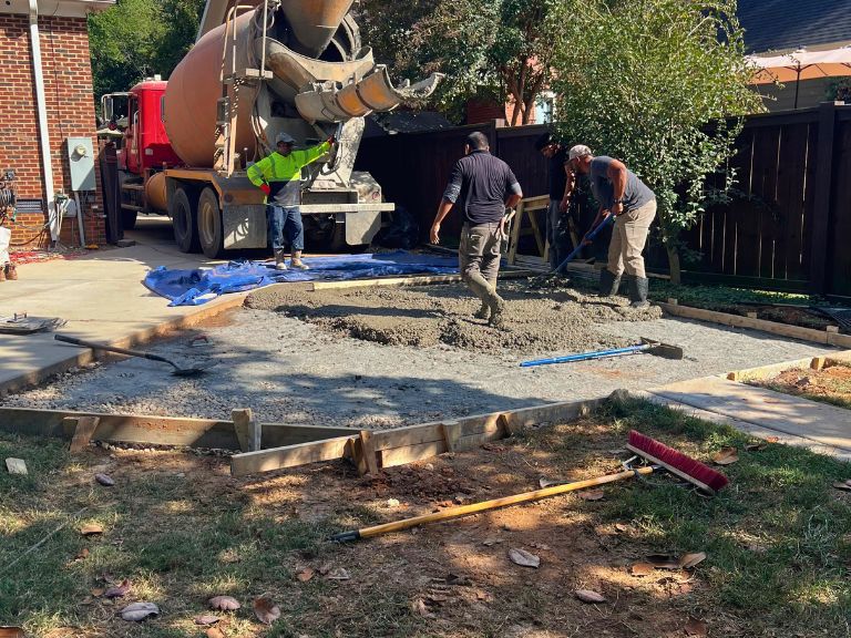 ready-mix truck pouring concrete for the driveway extension in grier heights, charlotte, nc