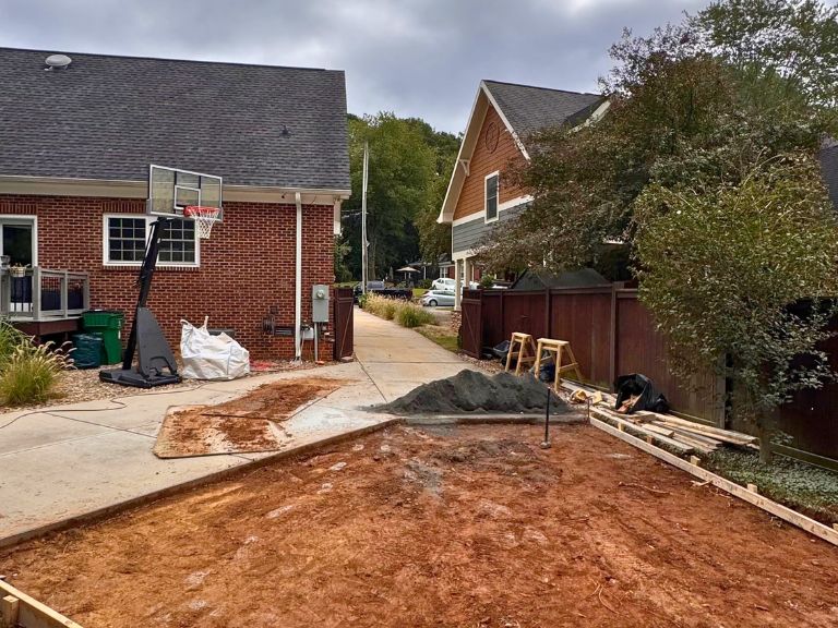 excavated subgrade and wood forms for the driveway extension, looking toward the house, in grier heights, charlotte, nc