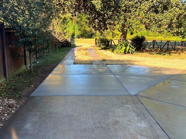 new concrete driveway extension with angled control joints tying into ribbon strips in grier heights, charlotte, nc