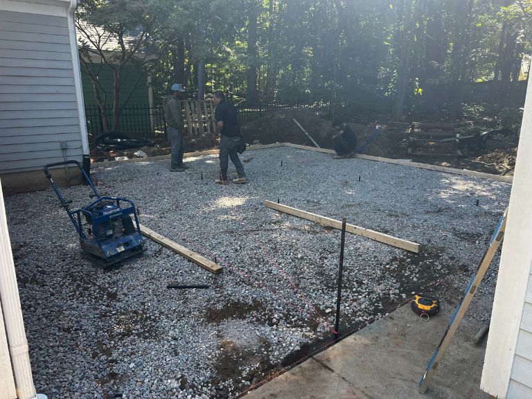 compacted gravel base and wood forms set for the new concrete patio in huntersville, nc